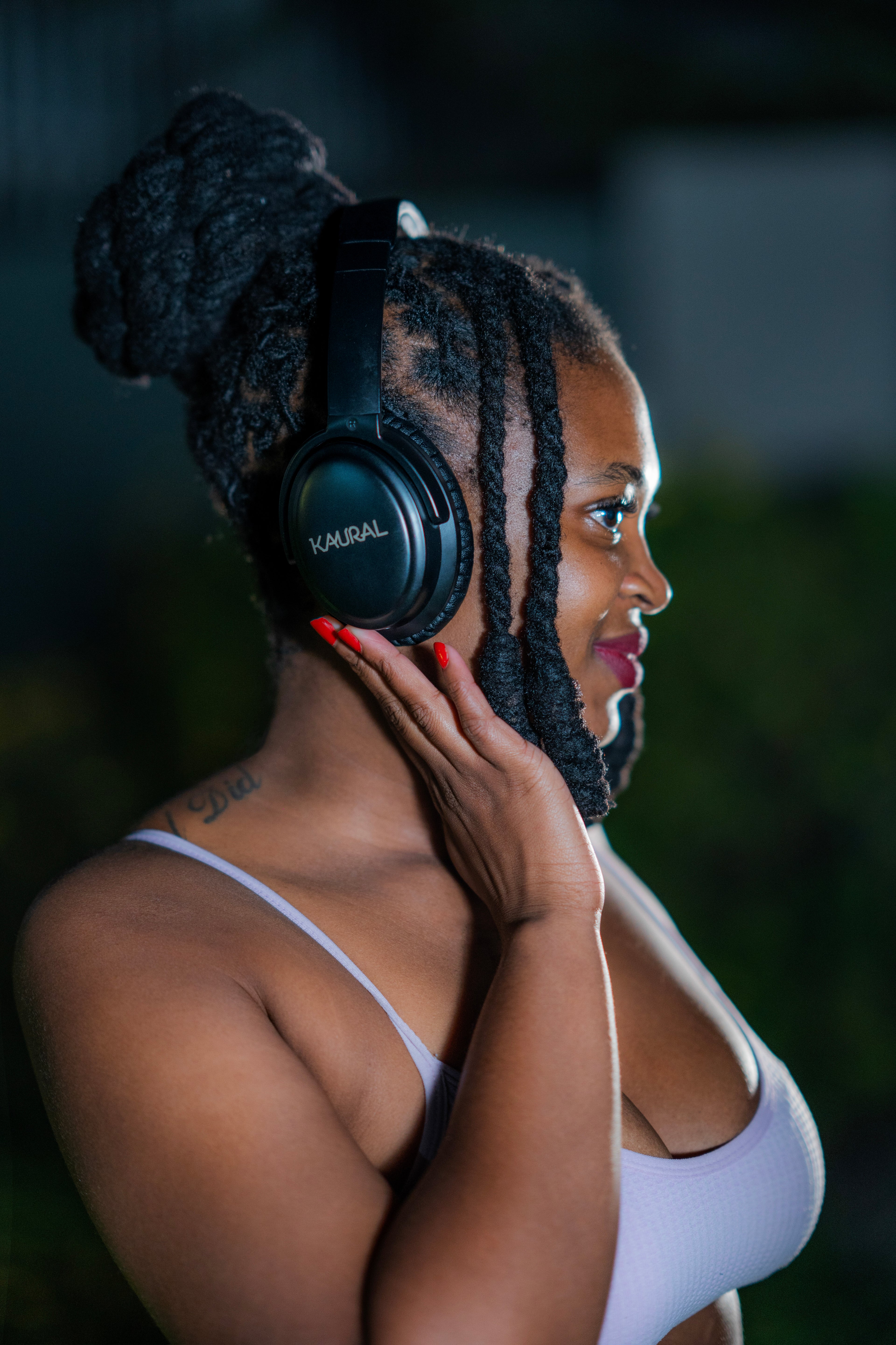 Woman wearing headphones with a blurred background